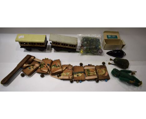 Toys and Juvenalia - a Schuco clockwork frog; a pair of Bing GBN tinplate railway passenger coaches; a Victorian Jacobs ladde