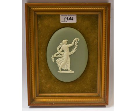 A Wedgwood jasperware oval plaque,  with applied classical lady on a sage green ground, 12.5cm high, framed