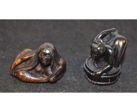 A Japanese erotic novelty hardwood netsuke, carved as bathing lady, 3.5cm high; another, as a recumbent mermaid, 4cm long, [2