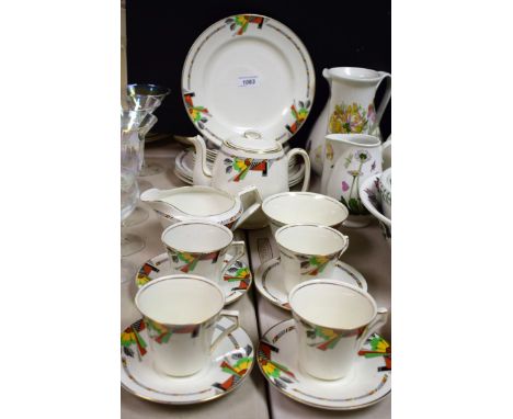 Ceramics - an Art Deco style part tea service, to include teapot, sugar bowl, cream jug, four dinner plates, four side plates