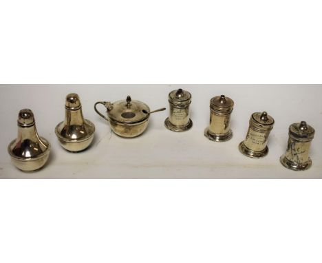 A George V silver three piece cruet set, Birmingham 1932; a silver four piece cruet set, engine turned, Birmingham 1934 (7)