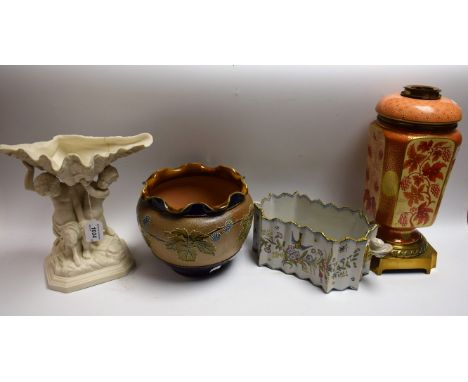 A 19th century parian table centre as a shell, supported by a faun and a putto, signed in the maquette; a Royal Doulton jardi