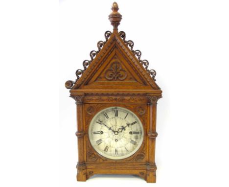 An early 20th century table clock, the dial signed J W Benson, 25 Old Bond Street, London, the gothic architectural case with