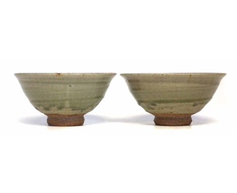 Jim Malone (1946-) two bowls, incised with a fish and a sun motif, impressed monograms to sides of foot rims, 16cm diameter  