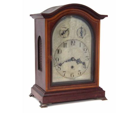 German mahogany cased bracket clock, with arched top cross banded and inlaid with satinwood, silvered arch top dial having tw