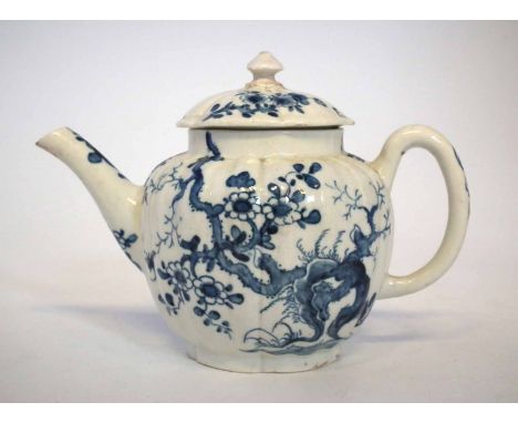 Worcester teapot circa 1760, with moulded body painted with Prunus Root pattern in underglaze blue, workman's mark to base, 1
