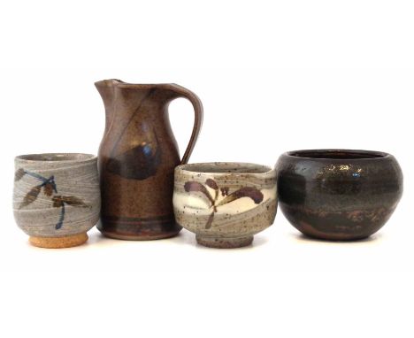 Four pieces of Studio Pottery, to include a yunomi by Geoffrey Whiting, another yunomi and jug by Simon Leach,and a small bow