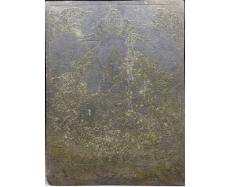 Tibetan slate panel incised with Buddha sitting on a lotus flower amongst clouds and auspicious emblems holding a conch and v