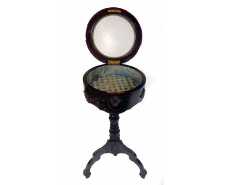 Late 19th century ebonised vitrine, circular hinged top with etched glazed panel covering buttoned silk lined interior, gilt 
