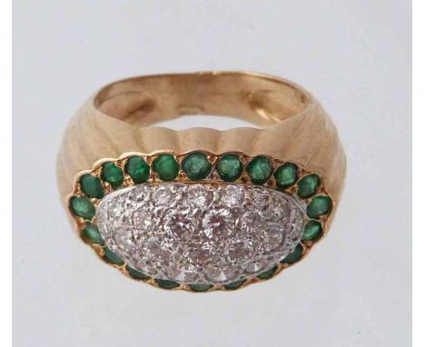 Diamond & emerald oval domed cluster yellow gold signet style ring, pavé set, diamond centre to an oval emerald set border su