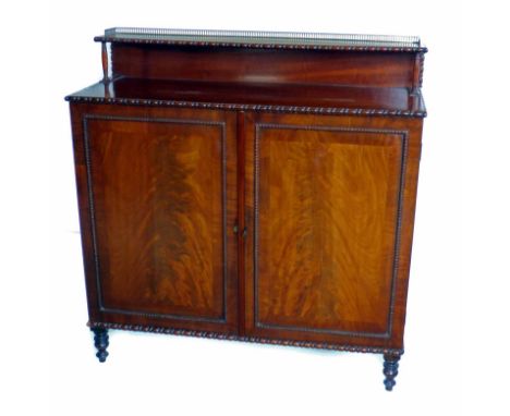 Victorian mahogany side cabinet. Brass galleried shelf above rectangular top with egg and bobbin mould bead. Base with two cu