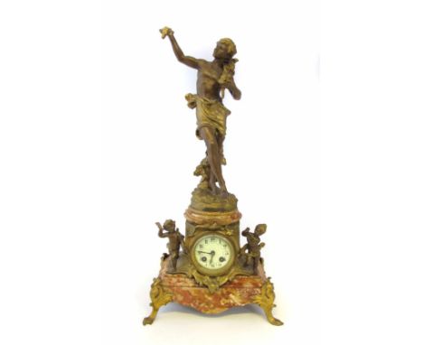 A 19th century French mantel clock, the marble base with a rococo style gilt spelter mount flanked by two putti and surmounte