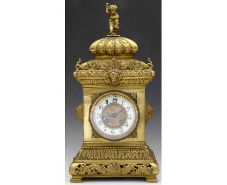 French cast brass rococo style mantel clock, late 19th century, the case of square section decorated with masks and scrolls, 