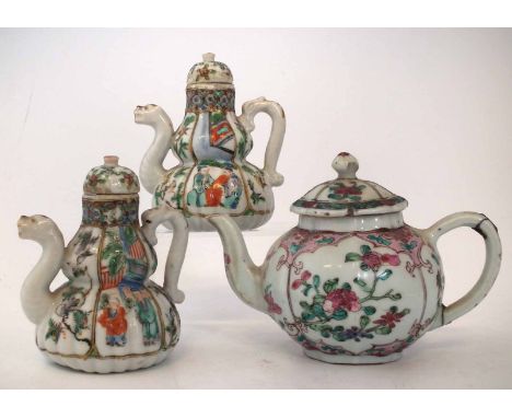 Chinese teapot, painted with a famille rose palette, also a pair of wine pots painted with figures in a famille verte palette