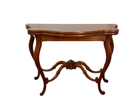 Victorian style mahogany card table of serpentine outline with baize lined fold over top on cabriole supports W98cm