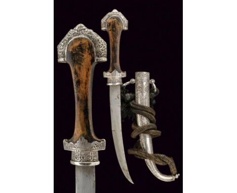 dating: first quarter of the 20th Century provenance: Morocco, Curved, single-and half-edged blade. Wooden grip with silver r
