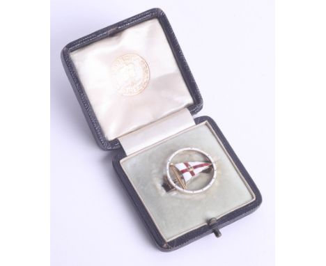 A 15ct Benzie enamel and gold flag brooch, Cowes, cased.