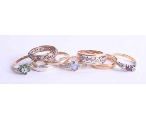 A collection of various dress rings include five 9ct gold rings (13.4g) and an 18ct ruby and diamond set three stone ring (2.