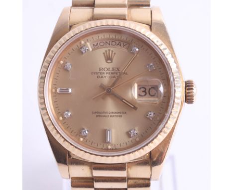 Rolex, a gentleman's 18ct yellow gold Rolex Oyster Perpetual Day-Date wristwatch, the circular face with fluted bezel, enclos