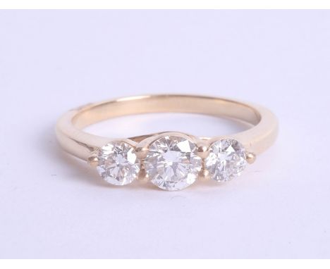 An 18ct diamond trilogy ring approx 1.00ct, estimated colour and clarity D/SI1, Size M.