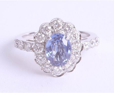 A sapphire and diamond cluster ring set in yellow gold, size M.