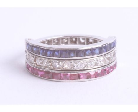 A diamond ruby and sapphire night and day ring set in platinum, size L.