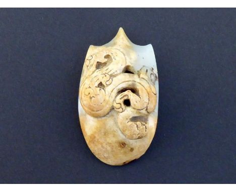 A Chinese carved white jade chicken heart pendant, the front carved in relief with a scrolling Chi dragon, most of the front 