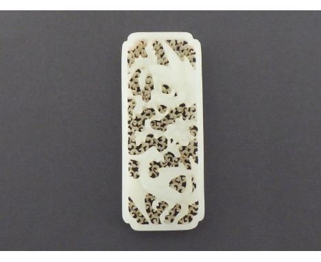 A Chinese white jade carved phoenix plaque, rectangular with incurved corners, back ground level pierced with scrolling cloud