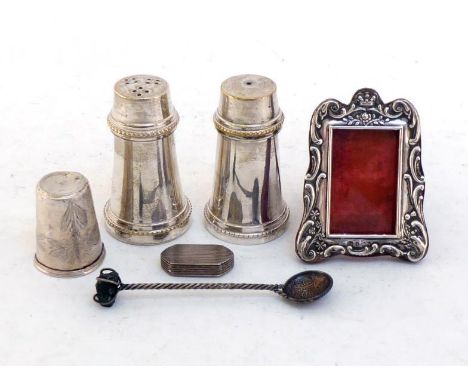 A mixed lot comprising:- a miniature silver-faced photo frame in morocco leather with strut back, Birmingham, 1901; a Contine