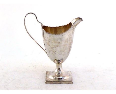 A George III silver helmet cream jug by William Burch, London, 1792, on square pedestal foot, wavy rim, 13 cm. high, wt. 91 g