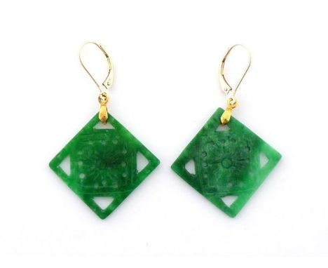 A pair of jade earrings, the pierced squares cut with a flower design, 2.1cm wide, with yellow metal hook fittings CONDITION: