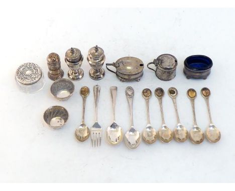 A small group of silver comprising:- a pair of peppers (loaded bases); a 3-piece slat-pierced condiment set, Birmingham, 1919