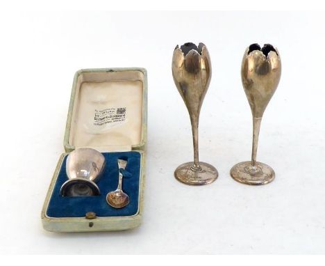 A pair of Edwardian silver tulip form specimen vases, Birmingham, 1909, 15 cm. high; also a commemorative silver egg cup and 