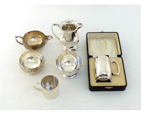 A group of silver comprising:- a cream jug on pedestal foot, Birmingham, 1913;  a sugar bowl in form of a rose bowl, London, 