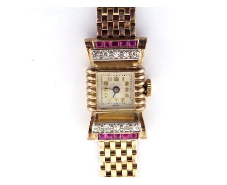 A 1940s ruby and diamond and yellow metal (tests 9 carat gold) bracelet watch, the 'bow-tie' bezel set top and bottom with a 