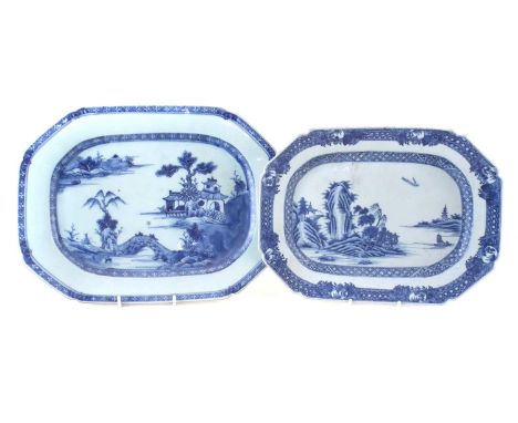 Two Chinese export porcelain meat plates, painted with landscapes in underglaze blue, late 18th century.The largest item meas