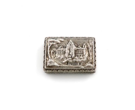 A William IV silver 'castle-top' vinaigrette, Tintern Abbey, by Edwin Jones, Birmingham 1836, rectangular form, the hinged co