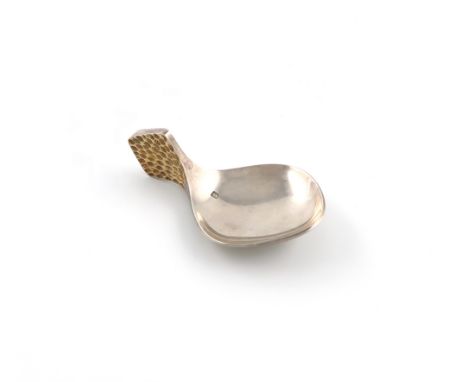 By Stuart Devlin, a parcel-gilt silver caddy spoon, London 1976, rounded rectangular bowl, the handle with textured, silver-g