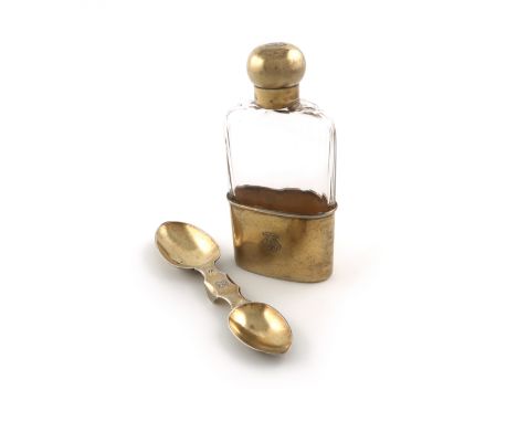 A French silver-gilt spirit flask and double medicine spoon, by G. Keller, Paris, the flask with a plain glass body, pull-off