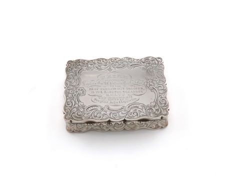 A Victorian presentation silver snuff box, by Nathaniel Mills, Birmingham 1845, rectangular form, chased foliate scroll decor