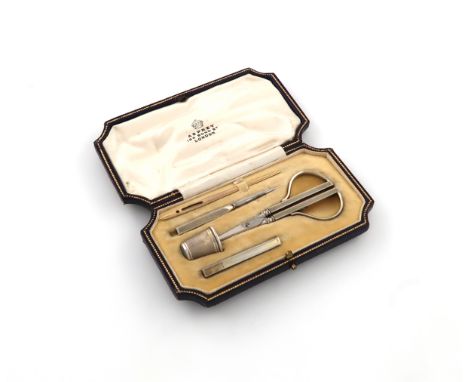 Retailed by Asprey, a silver-gilt sewing set, with import marks for London 1932, engine-turned decoration, comprising: a pair