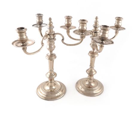 A pair of modern silver three-light candelabra, by Nat Leslie Ltd., London 1965, knopped baluster stems, on raised circular b