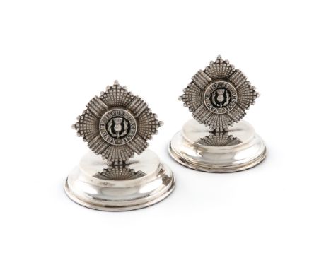 A pair of Regimental silver menu card holders, The Royal Scots, by Collingwood &amp; Co, London 1924, modelled as the regimen