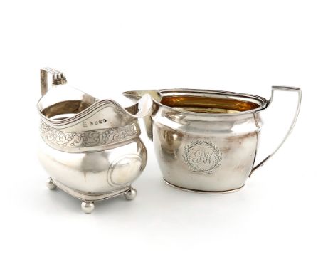 A George III silver cream jug, by John Emes, London 1803, oval from, reeded border and scroll handle, engraved with initials,