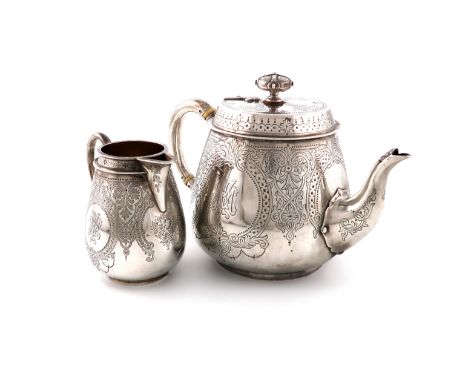 λA Victorian silver teapot and cream jug, by Stephen Smith, London 1869, tapering circular form, engraved decoration, scroll 