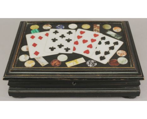 A 19TH CENTURY ITALIAN PIETRA DURA CARD BOX, the rectangular pietra dura panel inlaid with playing cards and counters in a mo