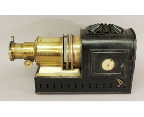 A LATE 19TH/EARLY 20TH CENTURY MAGIC LANTERN PROJECTOR with brass lens apparatus and tin body, unmarked. 43cm(L) CONDITION: T