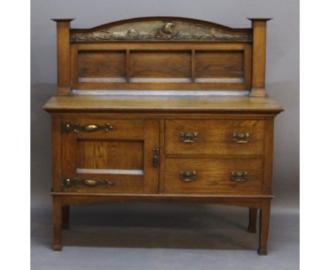 AN ARTS AND CRAFTS OAK SIDEBOARD having an arched raised back with embossed copper panel of a longboat at sea, plain columns,