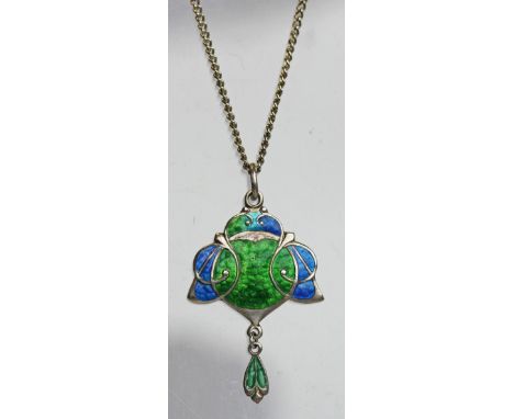 AN ART NOUVEAU SILVER AND ENAMEL PENDANT by James Fenton, Birmingham 1908, of stylised form with blue and green enamelling an