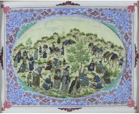 AN EARLY 20TH CENTURY MIDDLE EASTERN IVORY OVAL PANEL, painted in colours and gilt with nomadic hillside encampment featuring